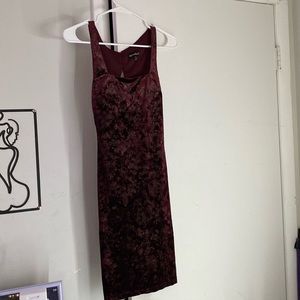 I’m selling a velvet red mini heart shaped back dress.